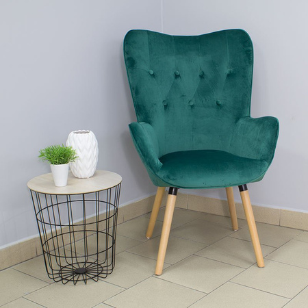 Fotel uszak z weluru pikowany na drewnianych nogach z podnóżkiem F150GR zielony