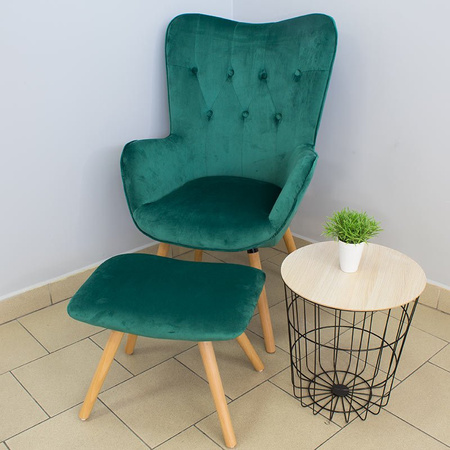 Fotel uszak z weluru pikowany na drewnianych nogach z podnóżkiem F150GR zielony