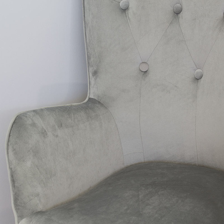 Fotel uszak z weluru pikowany na drewnianych nogach z podnóżkiem F150G szary